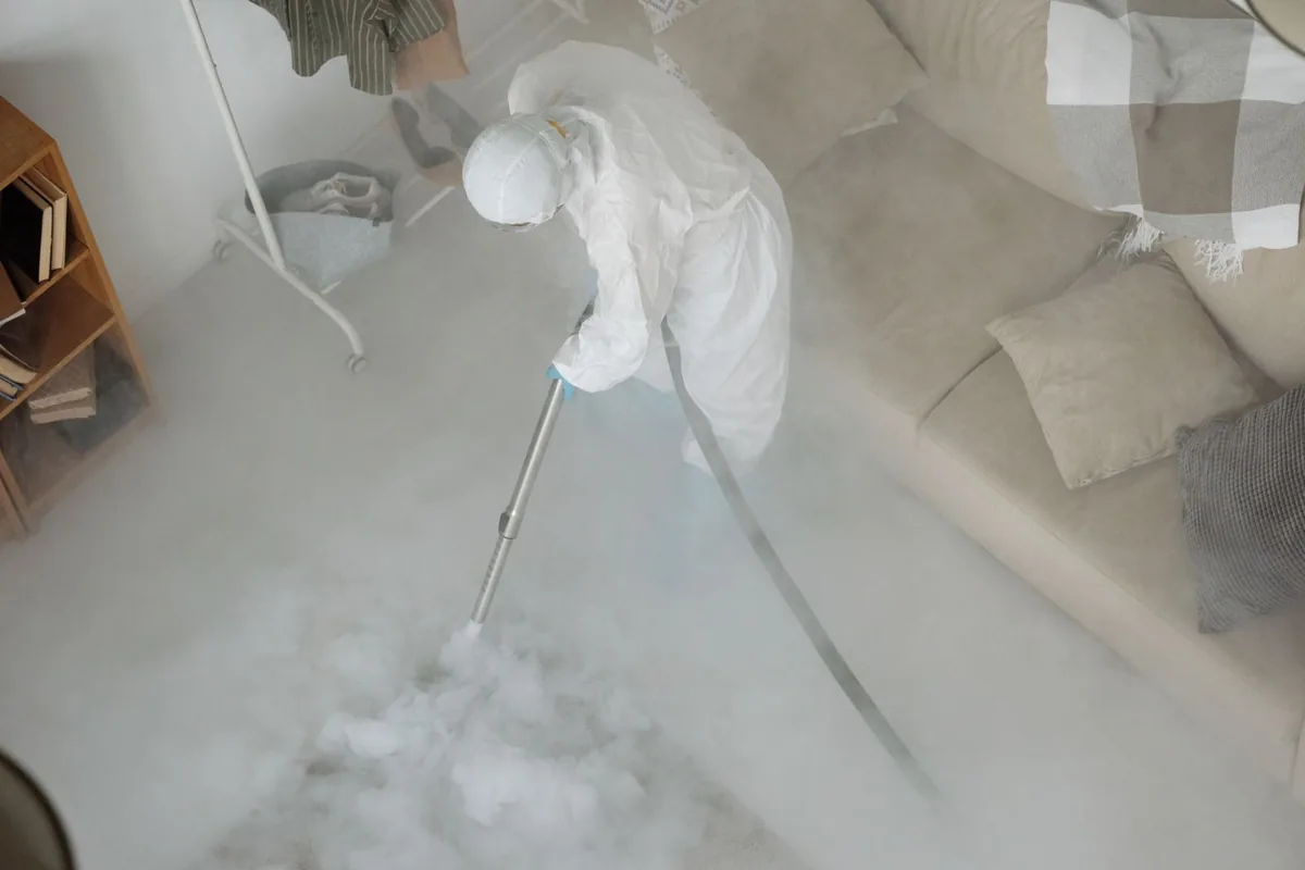 Biohazard cleanup technician in protective equipment, Greensburg, PA